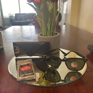 Ray-ban black frames green lenses almost look black.